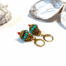 Turquoise met gouden boho oorbellen met rood