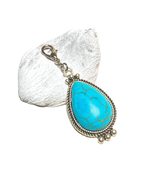 Turquoise hanger met Howliet in zilver